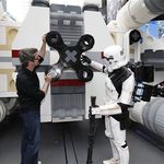 LEGO Master Builder Erik Varszegi and members of the 501st inspect the thrusters of the largest LEGO model ever built